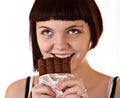 Young beautiful glutton eat chocolate isolated