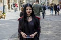 Young beautiful gothic girl on the street of Lviv city in Ukraine