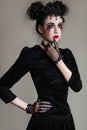 Young beautiful gothic woman with white skin and red lips. Halloween Royalty Free Stock Photo