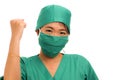 Young beautiful and happy Asian Chinese medicine doctor woman or hospital nurse in medical hat smiling cheerful behind surgeon Royalty Free Stock Photo