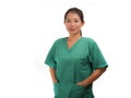 Young beautiful and happy Asian Korean medicine doctor woman or hospital nurse in green scrubs posing cheerful smiling confident