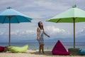 Young beautiful and happy Asian Korean woman in chic Summer dress and sunglasses posing relaxed at tropical beach relaxed at nice Royalty Free Stock Photo