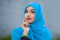 Young beautiful and happy Asian woman in hijab muslim head scarf posing to the camera playful having fun and looking seductive and