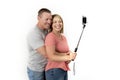 Young beautiful happy and attractive romantic couple with husband and wife or girlfriend and boyfriend taking selfie self portrait