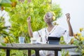 Young beautiful and happy black African American woman enjoying outdoors at cafe working with digital tablet listening to music wi Royalty Free Stock Photo