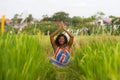 Young beautiful and happy black afro American woman sitting at rive field outdoors practicing yoga relaxation and meditation Royalty Free Stock Photo
