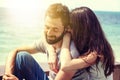 Young beautiful happy couple in love tenderly embracing against the background of the sea, love honeymoon Valentine`s Day concept Royalty Free Stock Photo