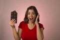 Young beautiful happy and excited woman holding big chocolate ba Royalty Free Stock Photo