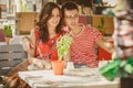Young beautiful happy loving couple sitting at street open-air cafe, hugging. Beginning of love story. Relationship love Royalty Free Stock Photo