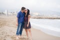 Young beautiful and happy mixed ethnicity couple of Asian woman and Caucasian man relaxed and cheerful walking playful  on beach Royalty Free Stock Photo