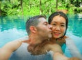 Young beautiful and happy mixed ethnicity couple beautiful Asian Chinese woman and white man in love taking selfie picture Royalty Free Stock Photo