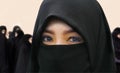 Young beautiful and happy Muslim woman in traditional Islam burqa dress with amazing expressive eyes looking at the camera and Royalty Free Stock Photo