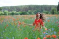 Young beautiful happy woman have a fun in spring poppy field. Concept freedom and happiness summer Royalty Free Stock Photo