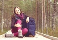 Young, beautiful and happy woman walking in forest. Camp, advent Royalty Free Stock Photo