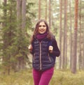 Young, beautiful and happy woman walking in forest. Camp, advent Royalty Free Stock Photo