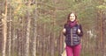 Young, beautiful and happy woman walking in forest. Camp, advent Royalty Free Stock Photo