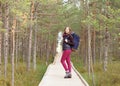 Young, beautiful and happy woman walking in forest. Camp, advent Royalty Free Stock Photo