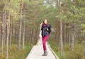 Young, beautiful and happy woman walking in forest. Camp, advent Royalty Free Stock Photo