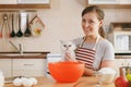 Young beautiful woman is cooking in the kitchen. Royalty Free Stock Photo