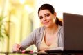 Young beautiful happy woman writing notes Royalty Free Stock Photo