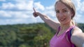 Young beautiful hiker woman taking selfie portrait on the top of mountain - Happy smiling girl using her smartphone - Royalty Free Stock Photo