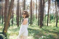 Young  hippie woman walks in the summer forest laughs dances and enjoys life and nature Royalty Free Stock Photo