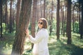 Young hippie woman walks in the summer forest laughs dances and enjoys life and nature Royalty Free Stock Photo