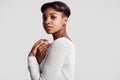 Young beautiful hipster black girl with short hair in white swea