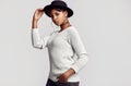 Young beautiful hipster black girl in white sweater and hat Royalty Free Stock Photo