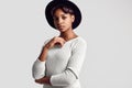 Young beautiful hipster black girl in white sweater and hat Royalty Free Stock Photo