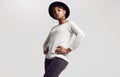 Young beautiful hipster black girl in white sweater and hat Royalty Free Stock Photo