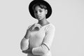 Young beautiful hipster black girl in white sweater and hat Royalty Free Stock Photo