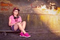 young beautiful hipster child girl sitting on skateboard