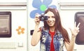 Young, beautiful hipster girl with vintage camera outdoors at summer. Vacation, holiday, concept. Royalty Free Stock Photo