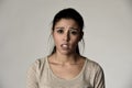 Young beautiful hispanic sad woman serious and concerned in worried depressed facial expression Royalty Free Stock Photo