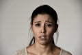 Young beautiful hispanic sad woman serious and concerned in worried depressed facial expression Royalty Free Stock Photo