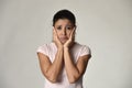 Young beautiful hispanic sad woman serious and concerned in worried depressed facial expression Royalty Free Stock Photo