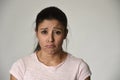 Young beautiful hispanic sad woman serious and concerned in worried depressed facial expression Royalty Free Stock Photo