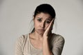 Young beautiful hispanic sad woman serious and concerned in worried depressed facial expression Royalty Free Stock Photo