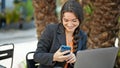 Young beautiful hispanic woman business worker make selfie by smartphone at park Royalty Free Stock Photo