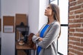 Young beautiful hispanic woman business worker standing with arms crossed gesture at office Royalty Free Stock Photo