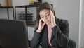 Young beautiful hispanic woman business worker stressed using computer at office Royalty Free Stock Photo