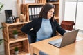 Young beautiful hispanic woman business worker suffering for backache working at office Royalty Free Stock Photo