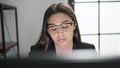 Young beautiful hispanic woman business worker tired using computer working at office Royalty Free Stock Photo