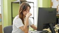 Young beautiful hispanic woman business worker using computer with sad expression at office Royalty Free Stock Photo