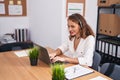 Young beautiful hispanic woman call center agent working at office Royalty Free Stock Photo