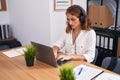 Young beautiful hispanic woman call center agent working at office Royalty Free Stock Photo