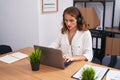 Young beautiful hispanic woman call center agent working at office Royalty Free Stock Photo