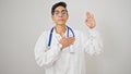 Young beautiful hispanic woman doctor making an oath with hand on chest over isolated white background Royalty Free Stock Photo