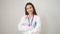 Young beautiful hispanic woman doctor smiling confident standing with arms crossed gesture over isolated white background Royalty Free Stock Photo